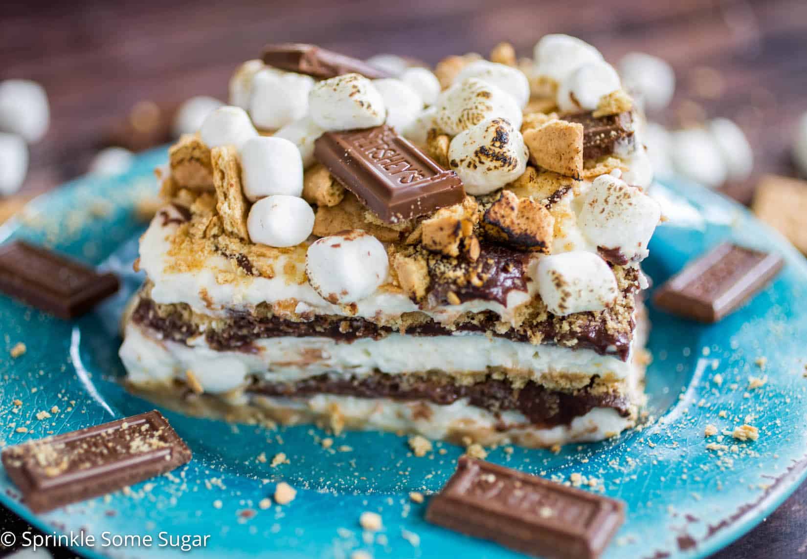 S'mores Icebox Cake - An over-the-top s'mores icebox cake complete with marshmallow whipped cream, soft chocolate ganache, graham crackers and toasted marshmallows! 