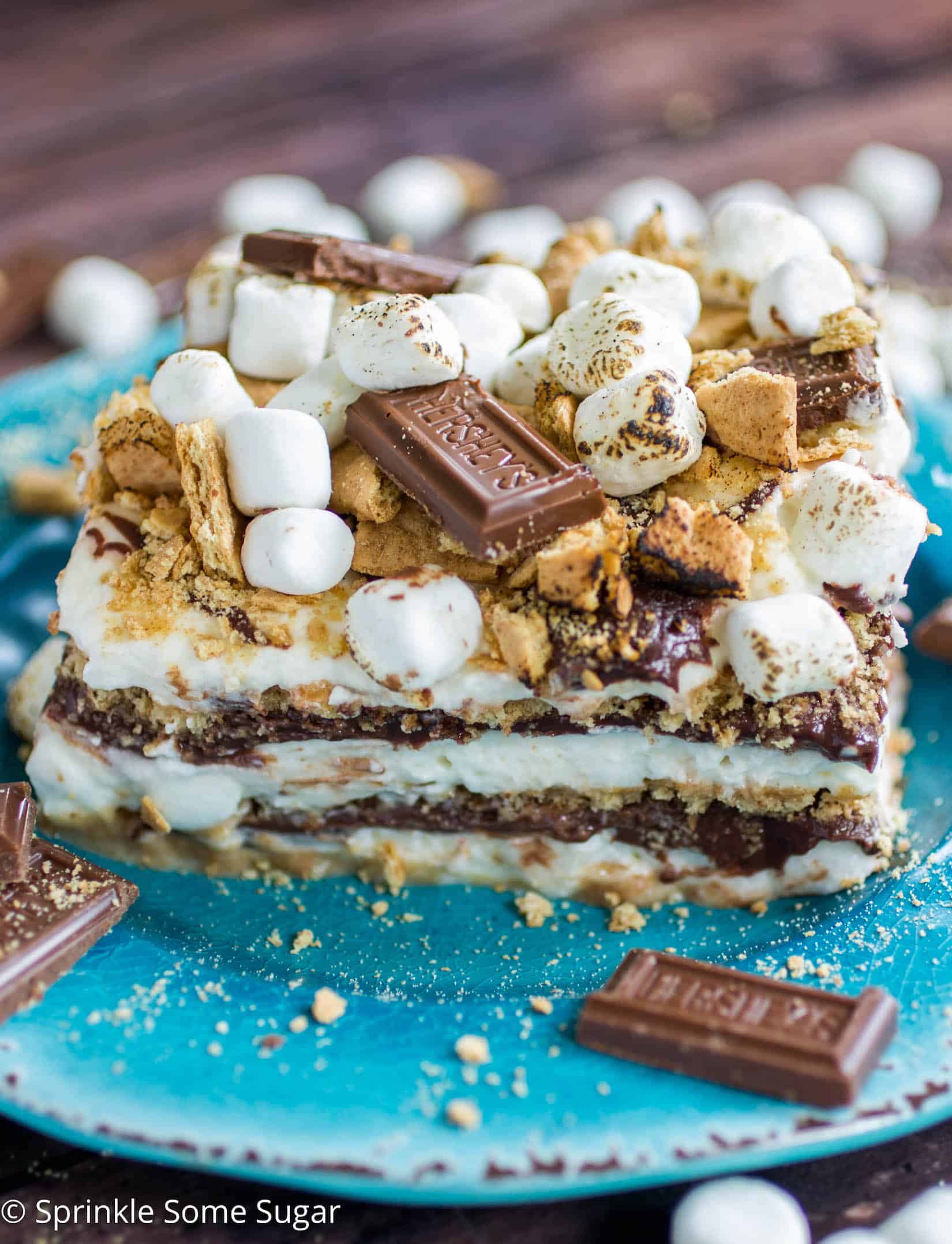 S'mores Icebox Cake - An over-the-top s'mores icebox cake complete with marshmallow whipped cream, soft chocolate ganache, graham crackers and toasted marshmallows! 