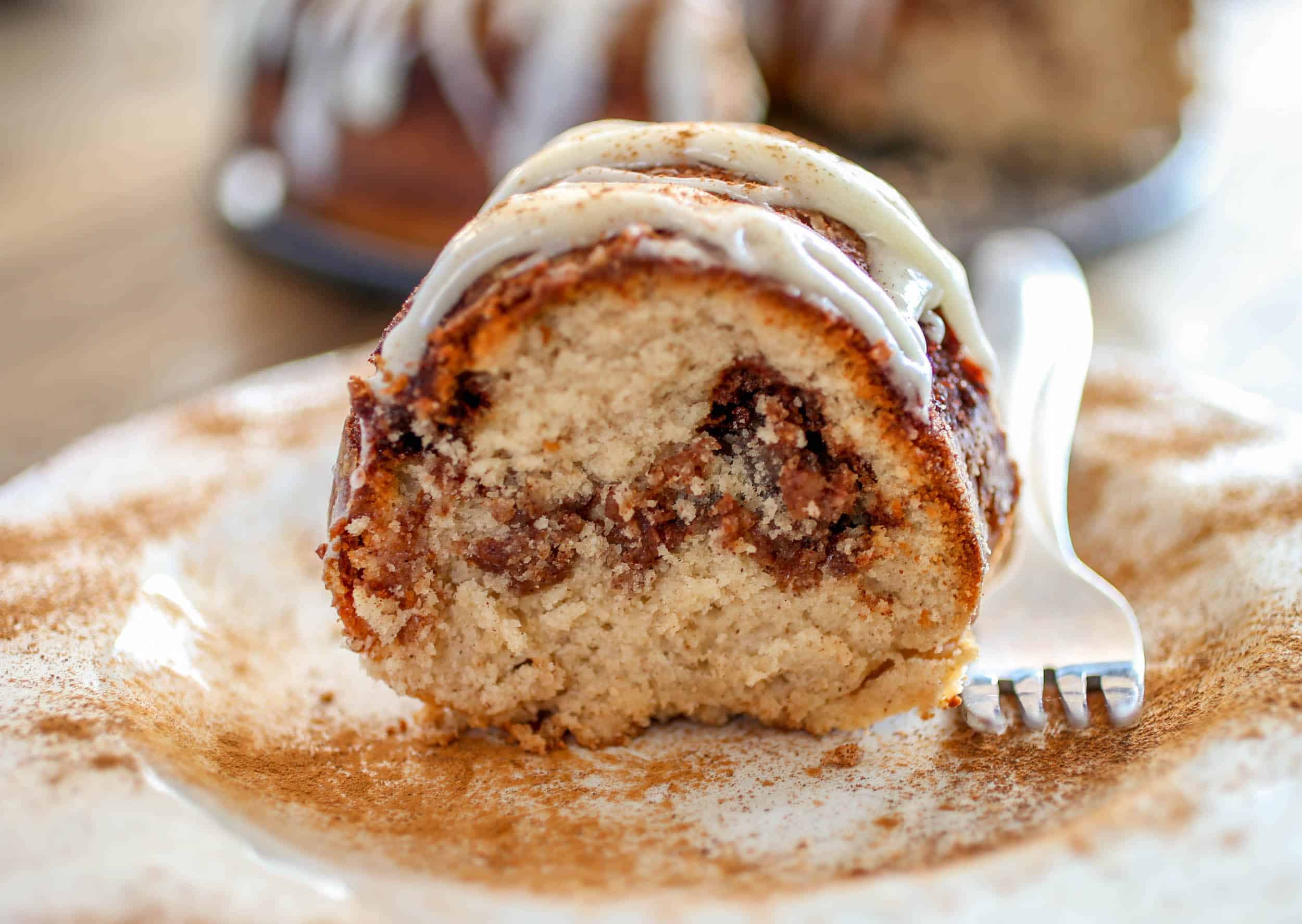 Cinnamon Roll Bundt Cake - From the gooey cinnamon swirl, to the iconic cream cheese icing on top, this Cinnamon Roll Bundt Cake is perfection for cinnamon roll lovers.