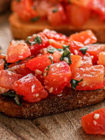 Easy bruschetta on a piece of crostini.