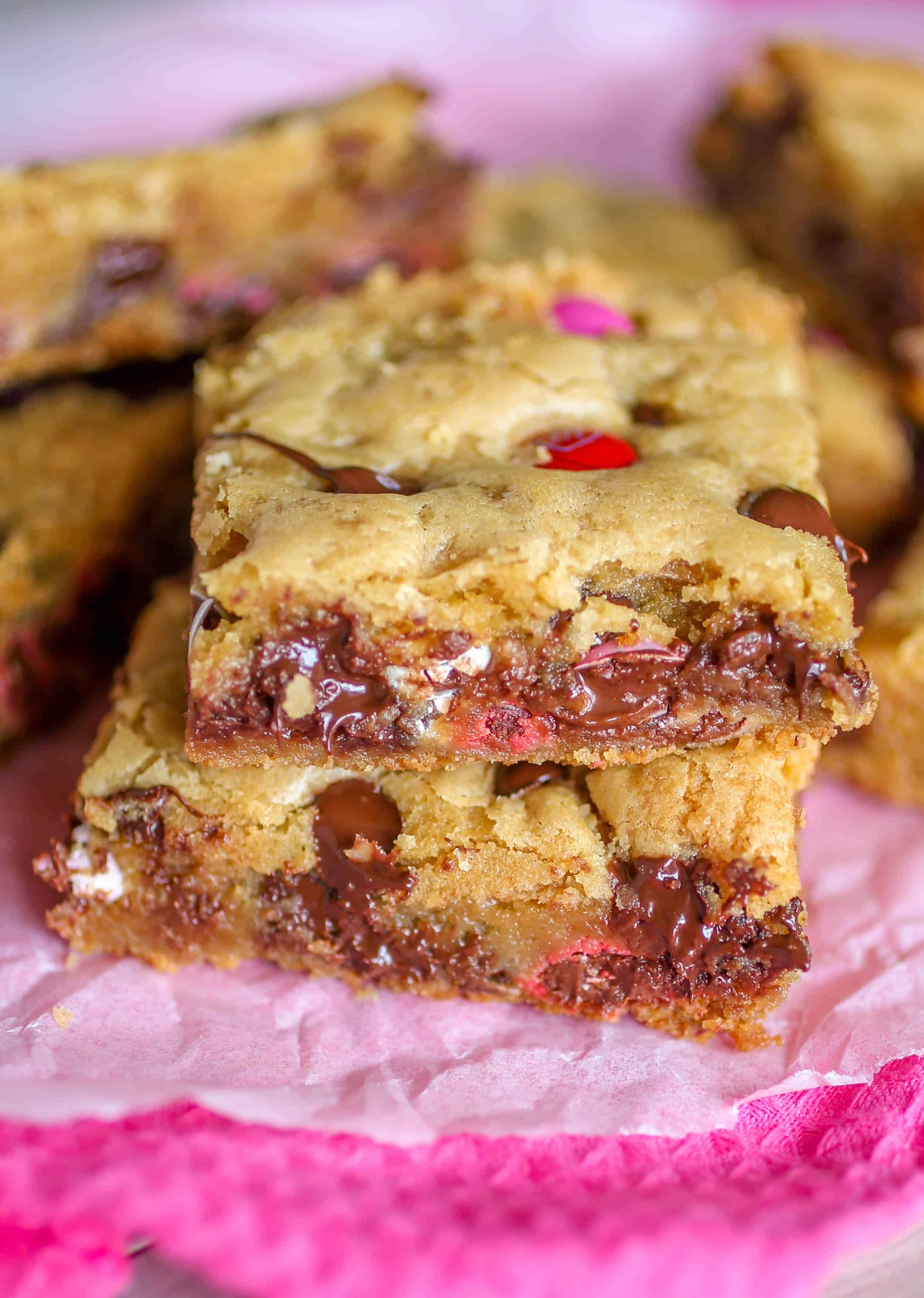 Soft and Chewy Chocolate Chip M&M Cookie Bars - These chewy chocolate chip M&M cookie bars are just the cookie fix you're looking for! Soft, chewy and chock full of chocolate. And no dough chilling required!