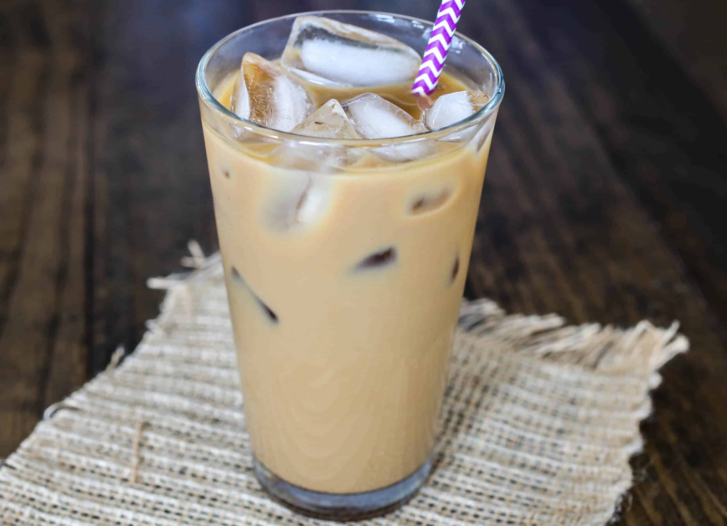 An easy, delicious homemade iced vanilla latte made at home with just a few simple ingredients! - Sprinkle Some Sugar
