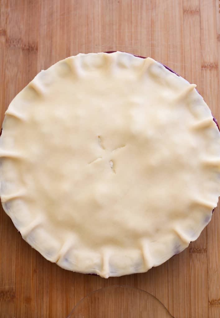 Second crust placed on top of pie.