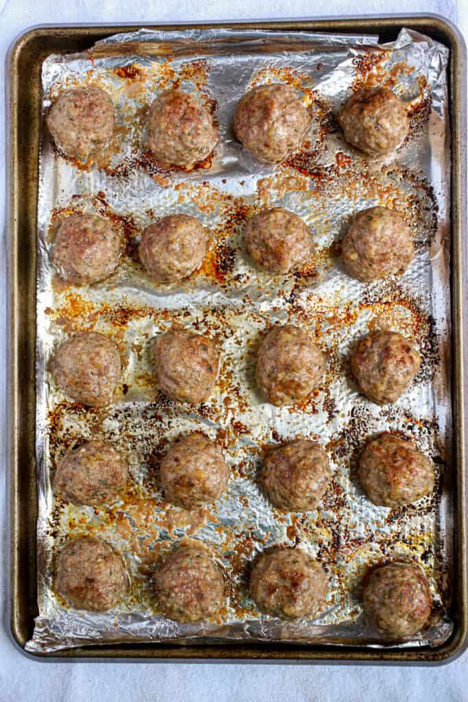 Baked meatballs on pan.