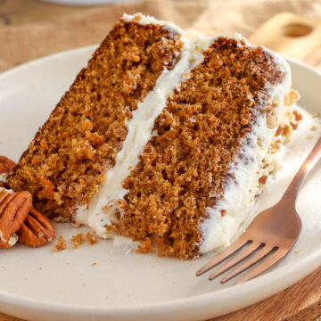 Carrot cake slice on a plate.