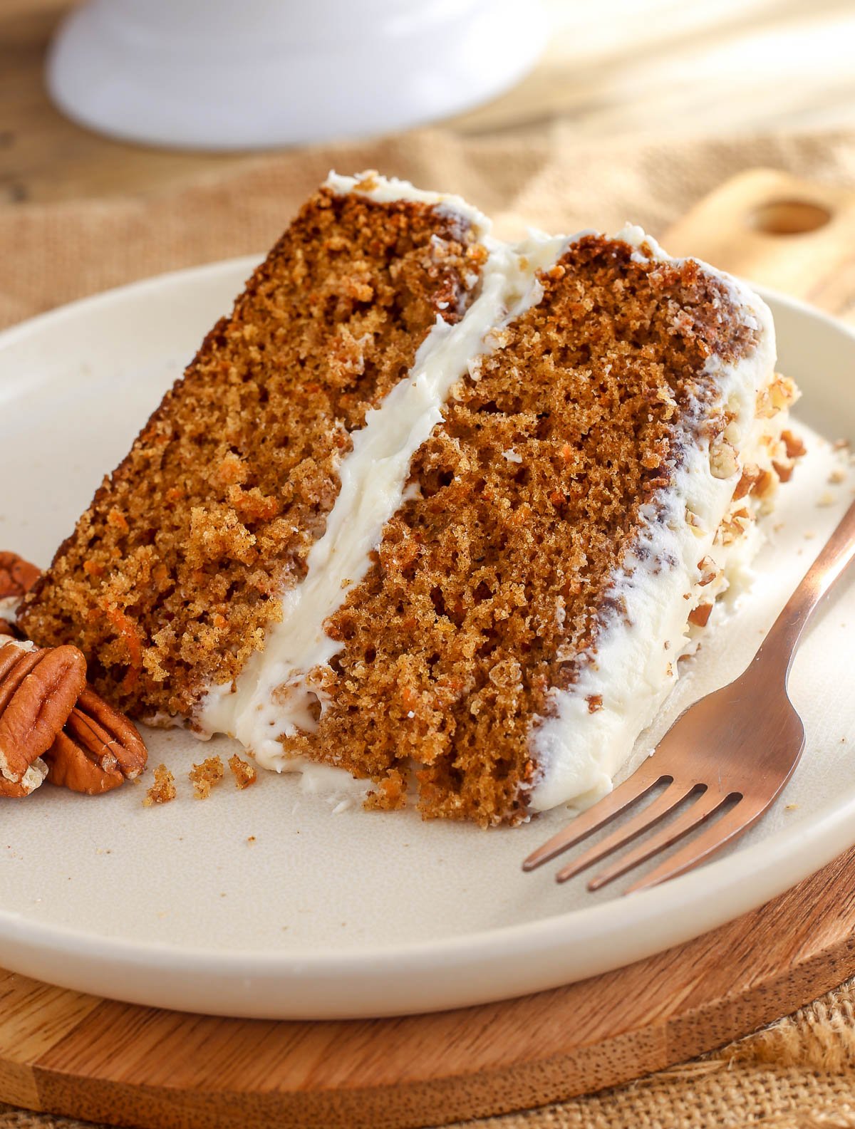 Carrot cake slice on a plate.