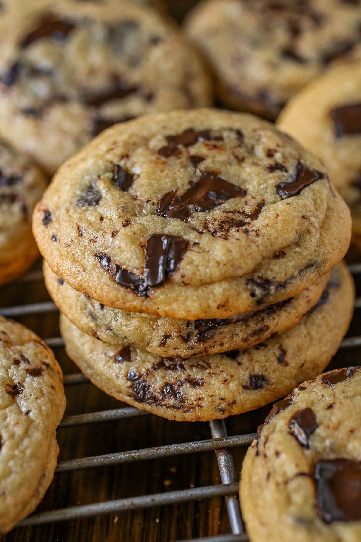 Stack of chocolate chip pudding cookies on a cooling rack.